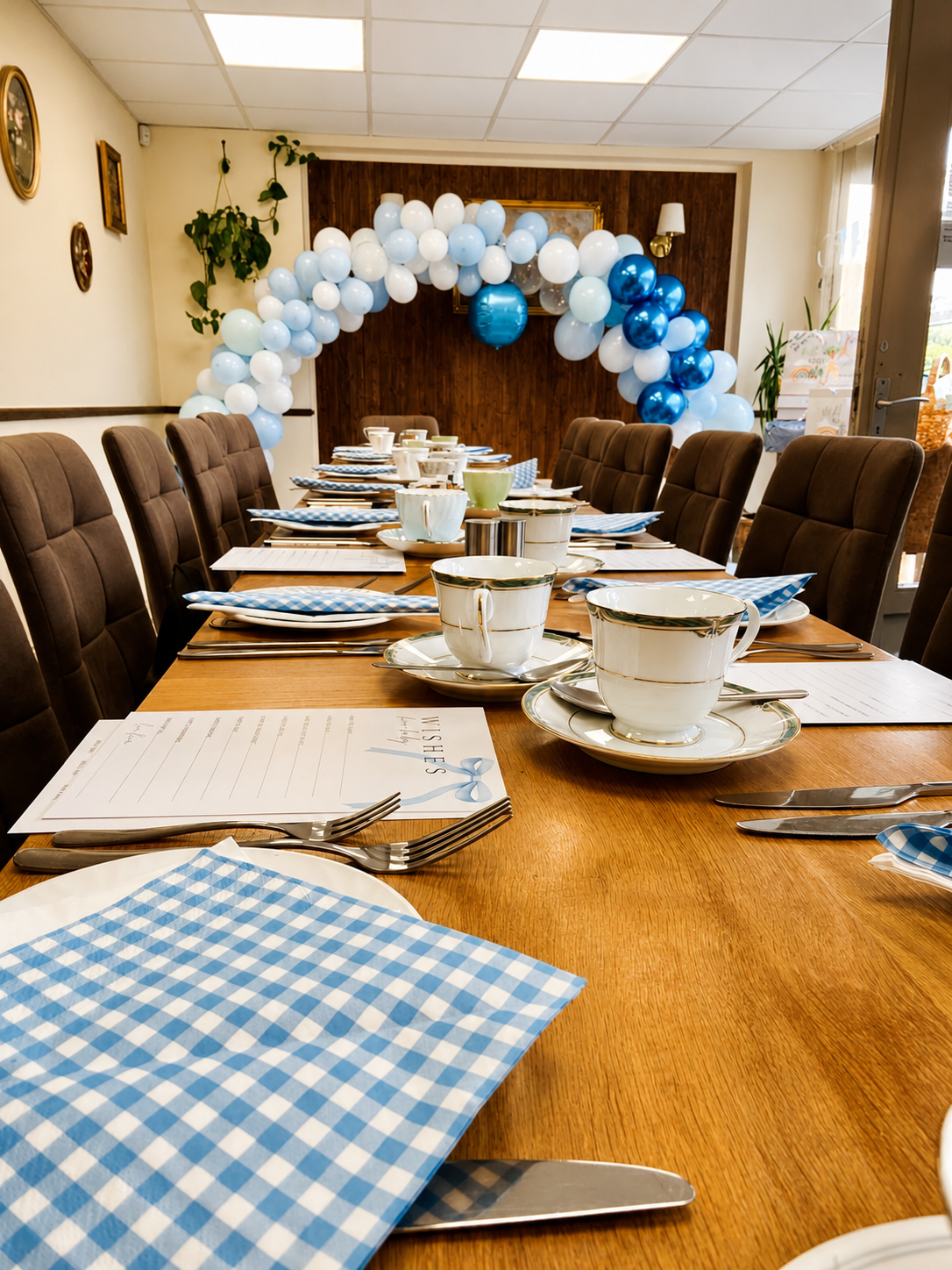 The Nook Cafe dining table arranged for a blue-themed celebration